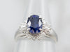 Modern Platinum Sapphire and Diamond Halo Ring