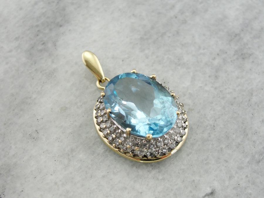 Stunning Blue Topaz Pendant with Diamond Halo in Two Tone Gold
