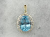 Stunning Blue Topaz Pendant with Diamond Halo in Two Tone Gold