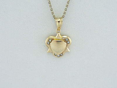 Layered Shapes: Vintage Geometric Gold Pendant with Seed Pearl Accents