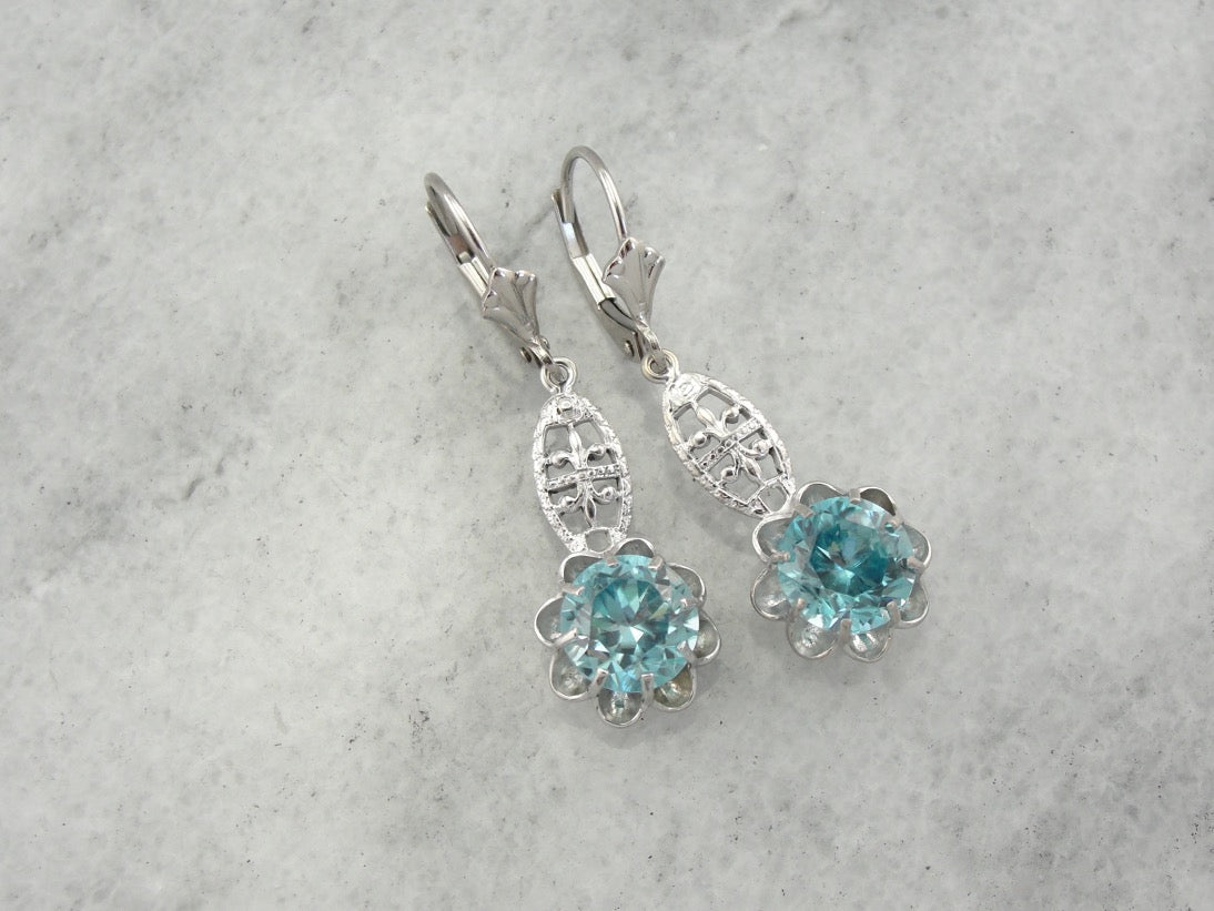 Bright Blue Zircon Buttercup Drop Earrings in White Gold