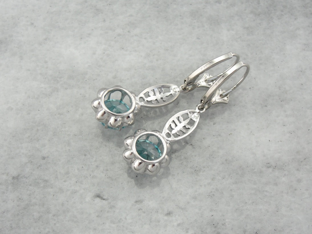 Bright Blue Zircon Buttercup Drop Earrings in White Gold