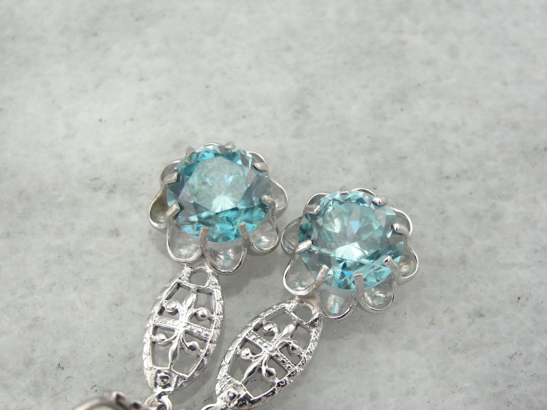 Bright Blue Zircon Buttercup Drop Earrings in White Gold