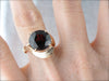Simplistic Bypass Design Garnet Solitaire in Rosy Yellow Gold