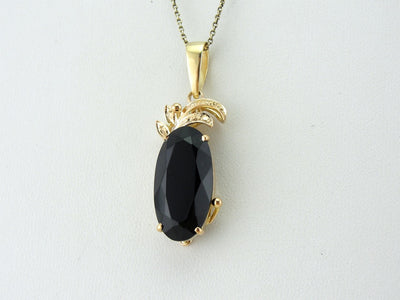 Mid Century Sleek Black Onyx Pendant with Faceted Top, High Karat Gold