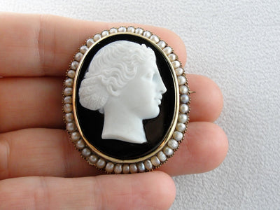 The Female Apostle Juniah: Antique Natural Pearl and Hardstone Black and White Onyx Cameo Brooch