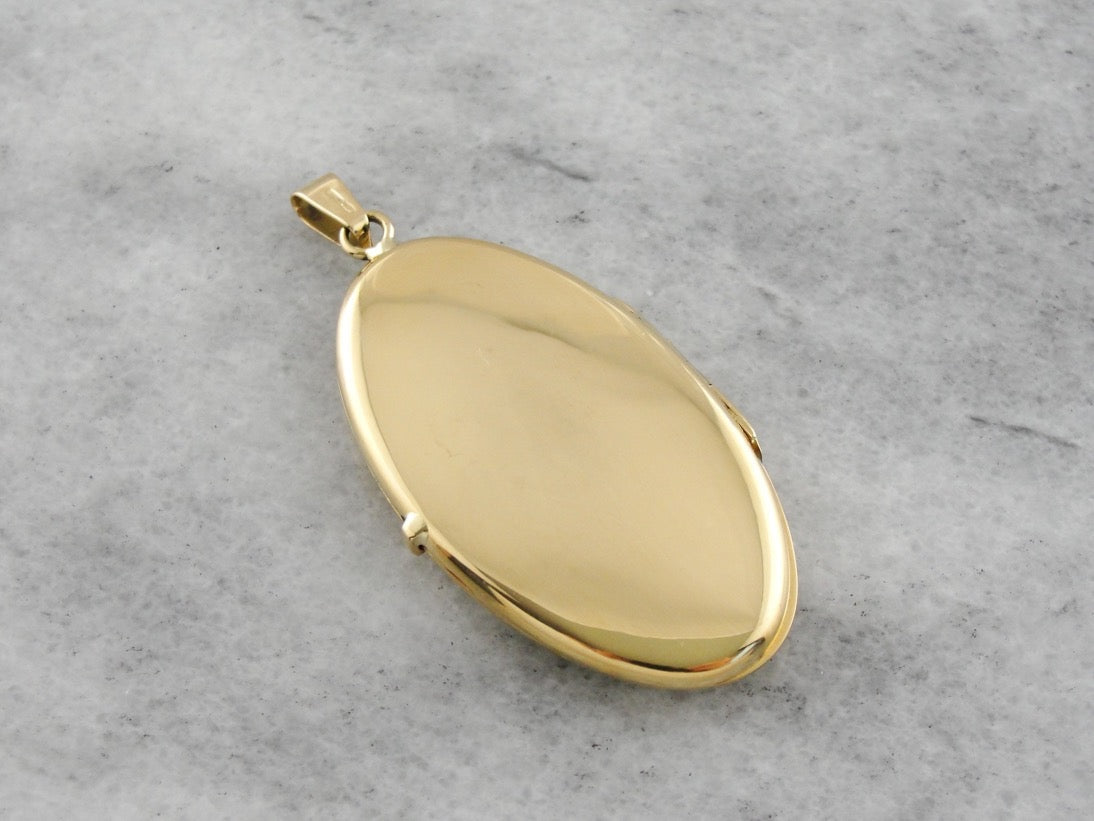 Vintage Yellow Gold Locket with Scrolling Floral Motif