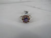 Amethyst Flower Ring with Surrounding Rubies