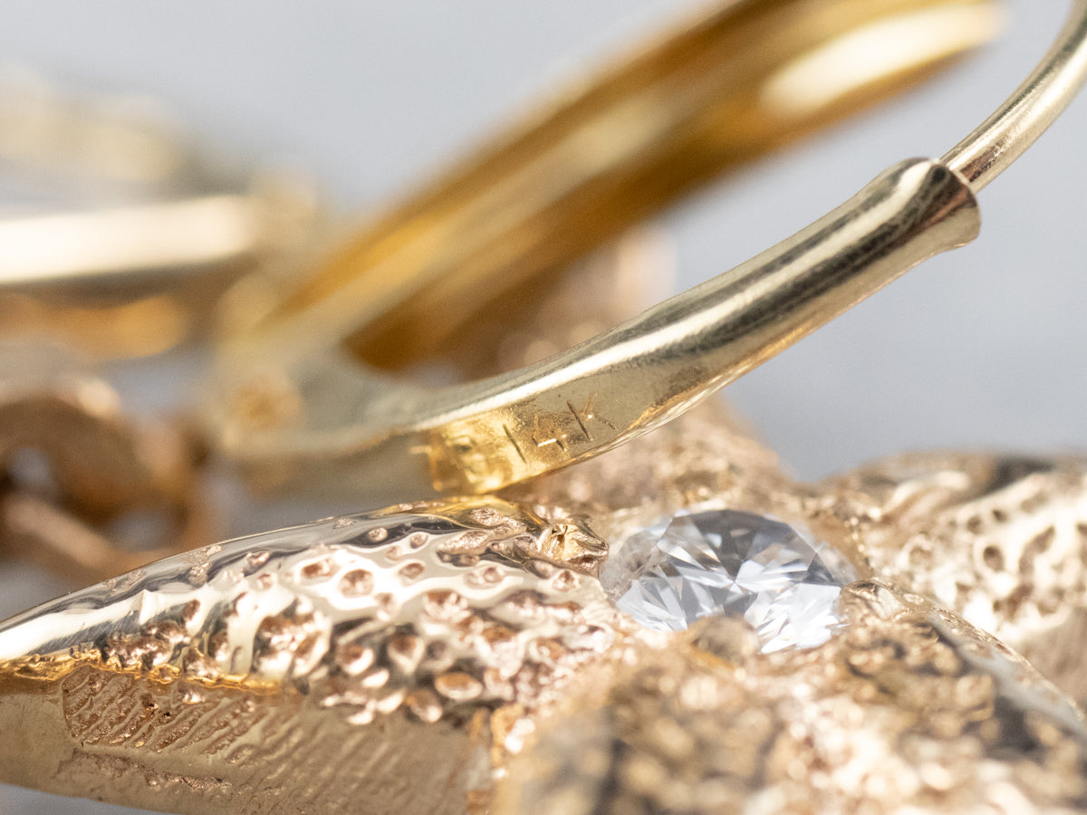 Pendientes colgantes con forma de estrella de mar y diamantes texturizados