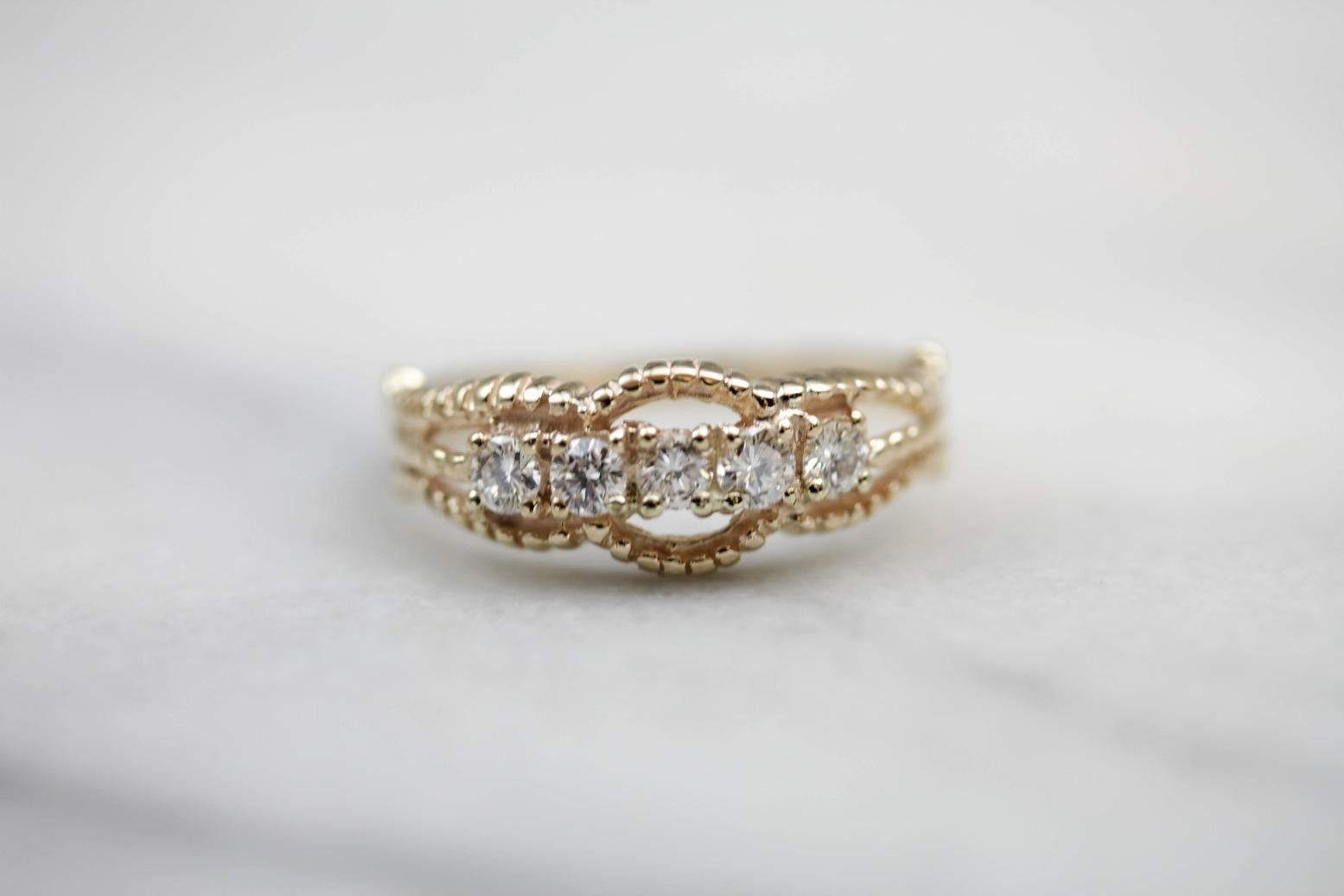 Five Diamond Gold Ring with Twist Details