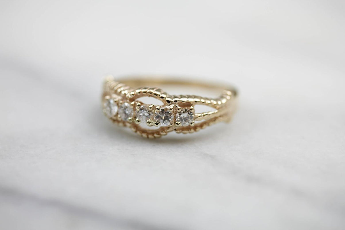 Five Diamond Gold Ring with Twist Details