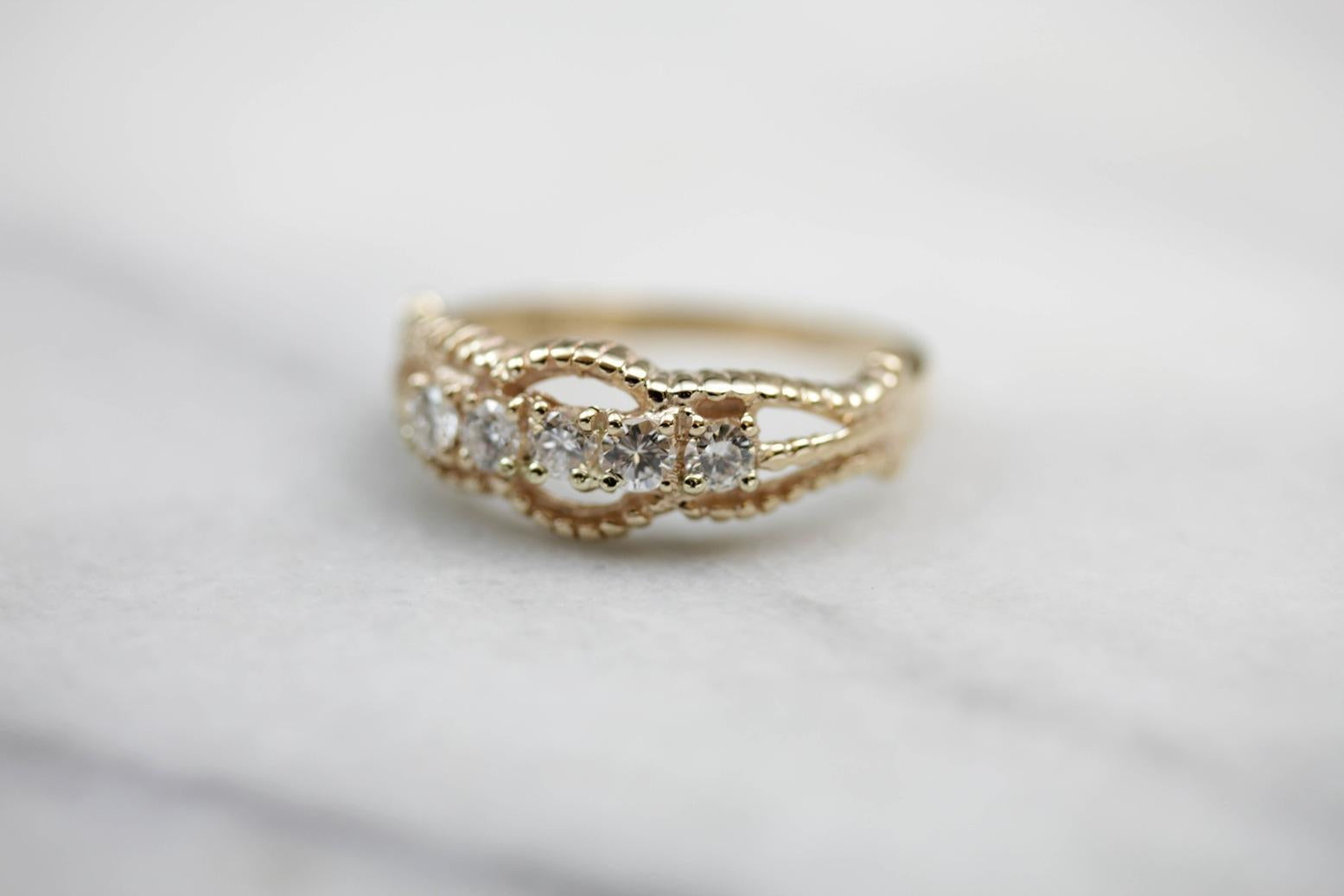 Five Diamond Gold Ring with Twist Details