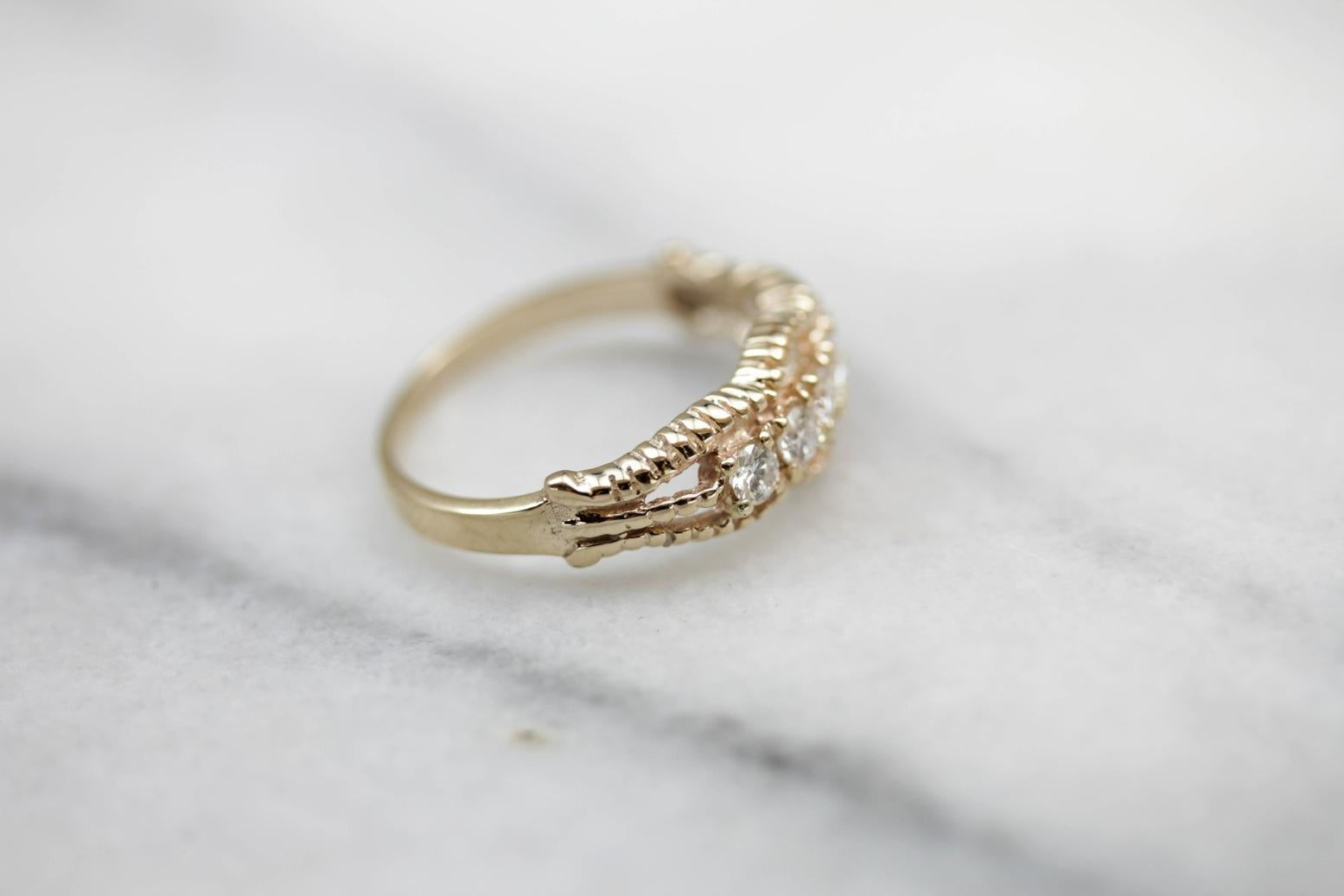 Five Diamond Gold Ring with Twist Details