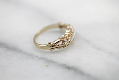 Five Diamond Gold Ring with Twist Details