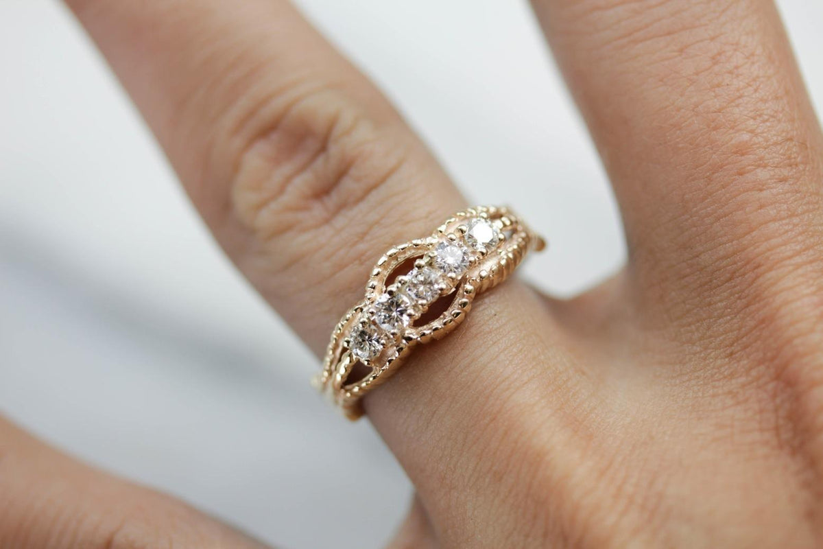 Five Diamond Gold Ring with Twist Details