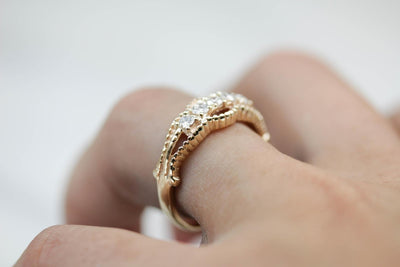 Five Diamond Gold Ring with Twist Details