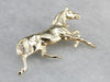 Golden Hooves: Galloping Horse Pin Crafted of Yellow Gold