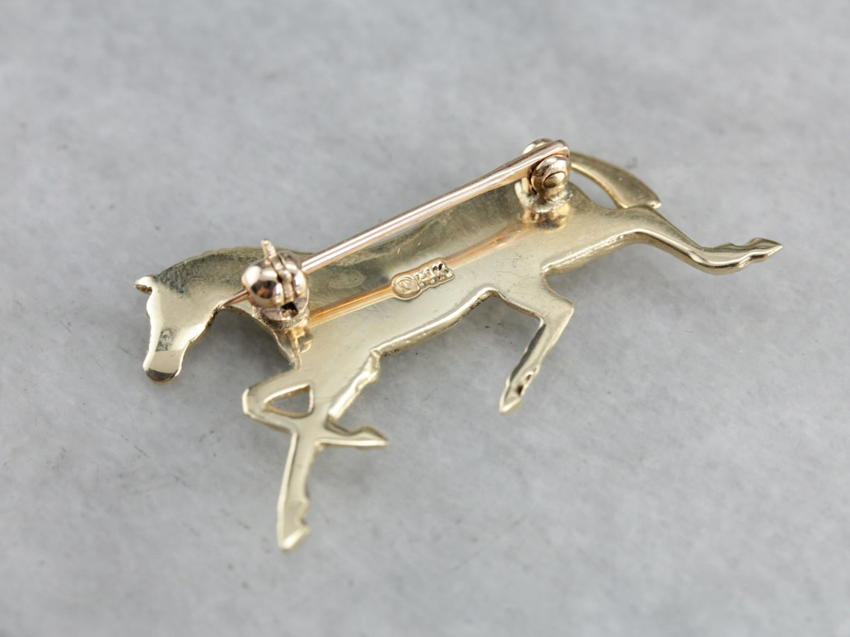 Golden Hooves: Galloping Horse Pin Crafted of Yellow Gold