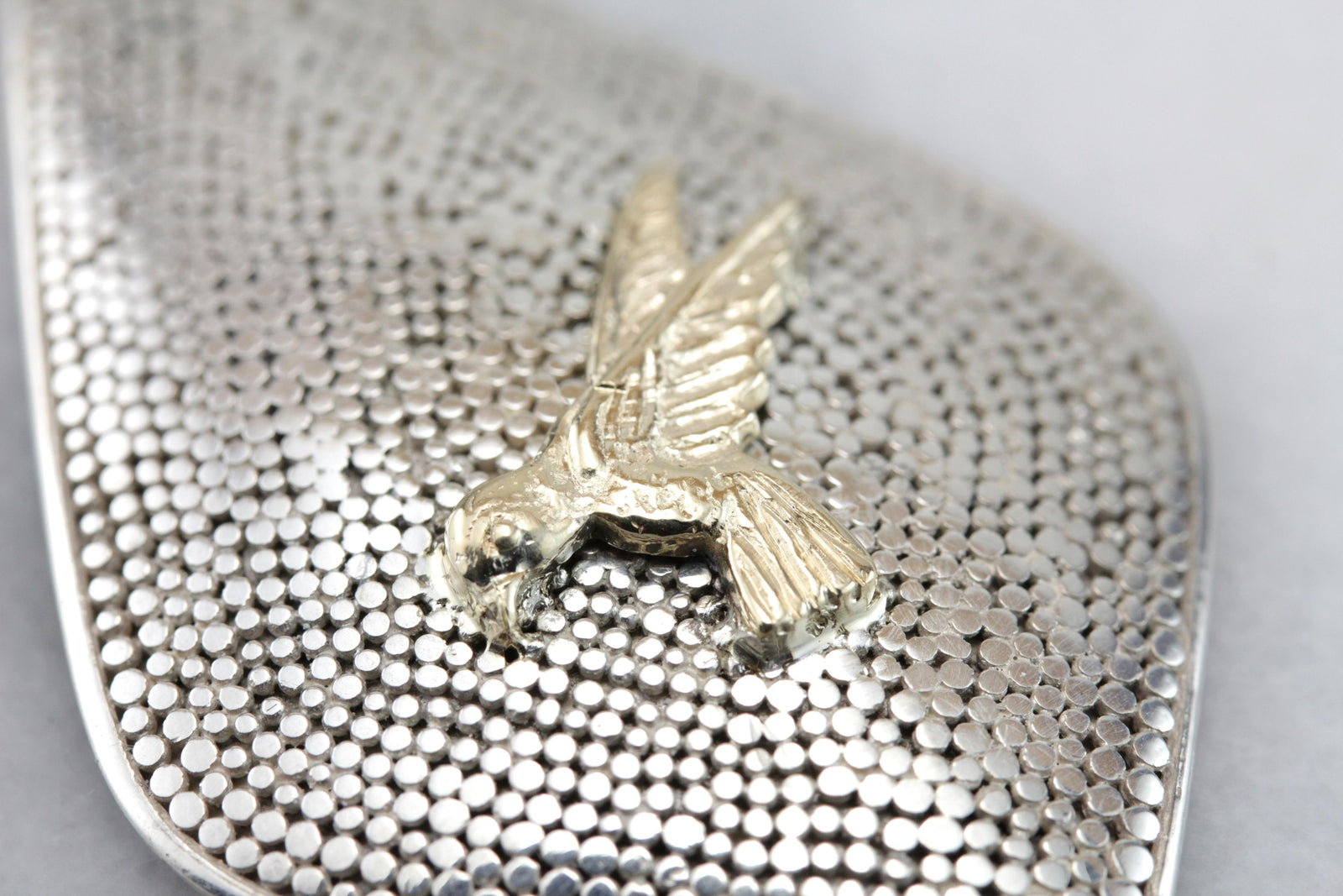 The Golden Parrot: Textured Bird in Flight Pendant