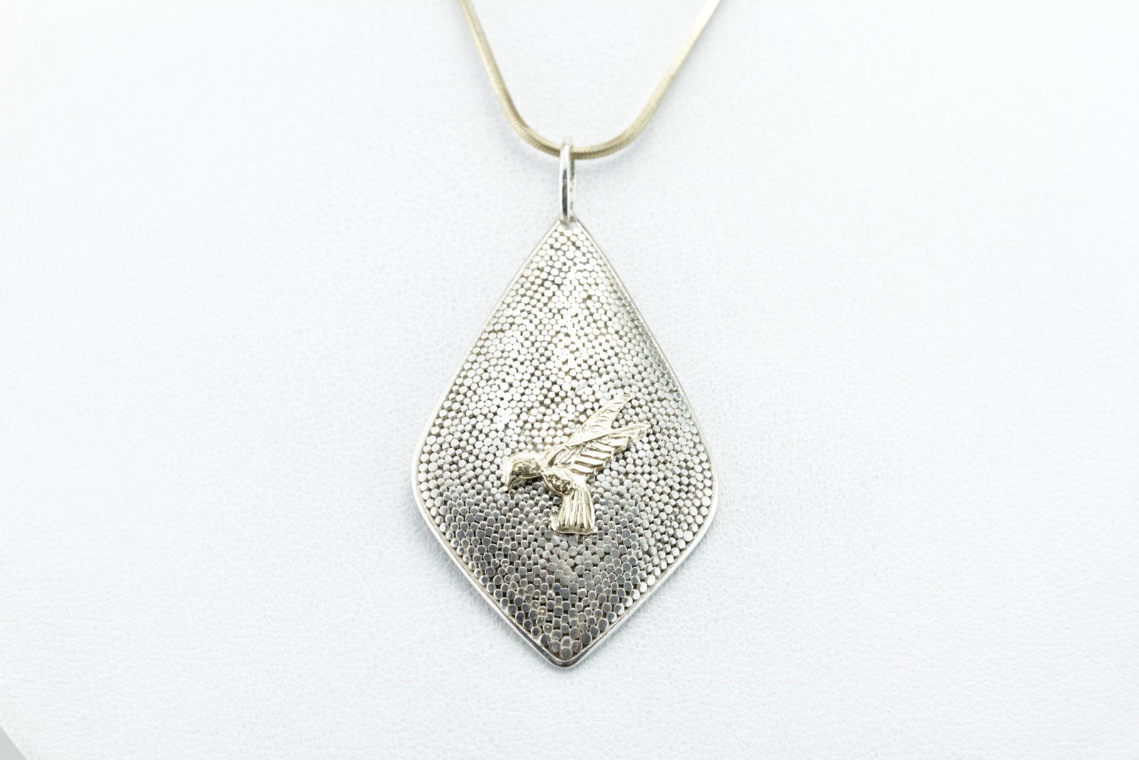 The Golden Parrot: Textured Bird in Flight Pendant