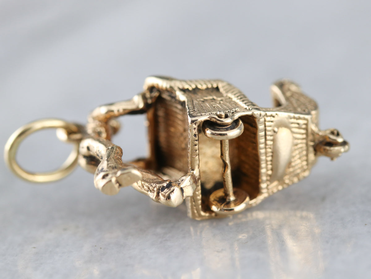 Man Pushing Sleigh Charm