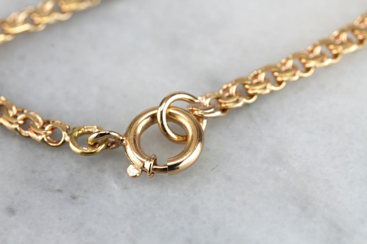 Cadena de eslabones ovalados de oro rosado, plana