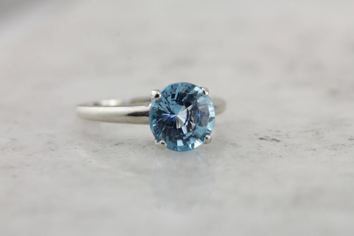 October Sky Engagement: Brilliant Round Blue Topaz Solitaire Ring
