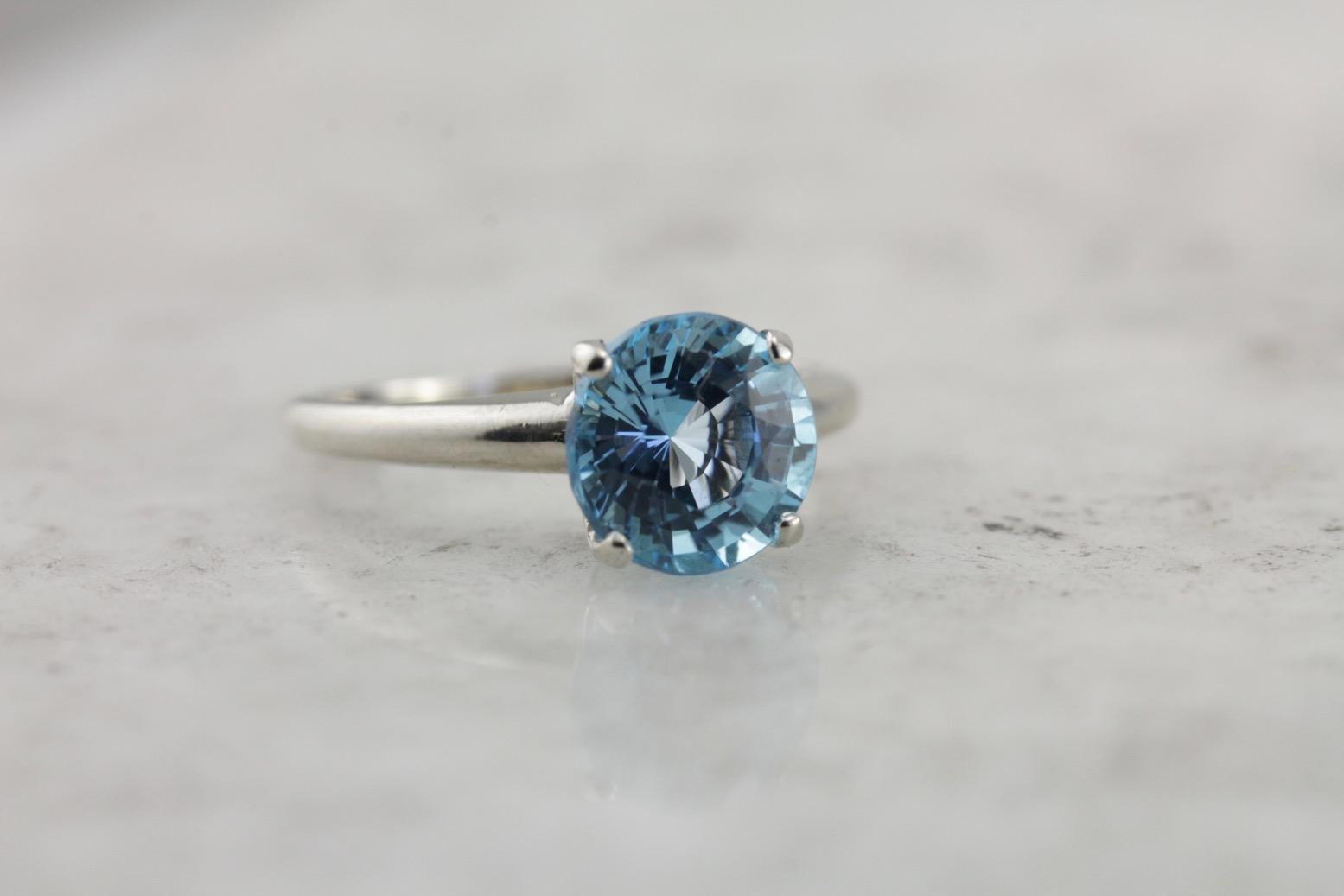 October Sky Engagement: Brilliant Round Blue Topaz Solitaire Ring