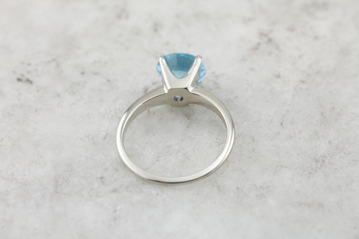 October Sky Engagement: Brilliant Round Blue Topaz Solitaire Ring