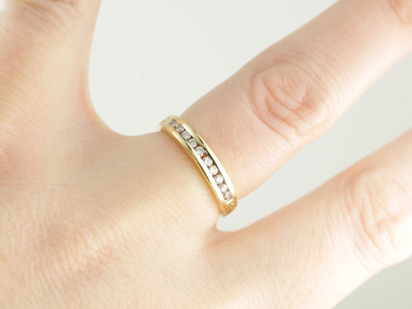 Channel Set Diamond Wedding Band in Polished Yellow Gold
