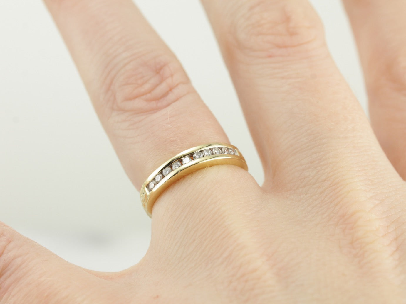 Channel Set Diamond Wedding Band in Polished Yellow Gold