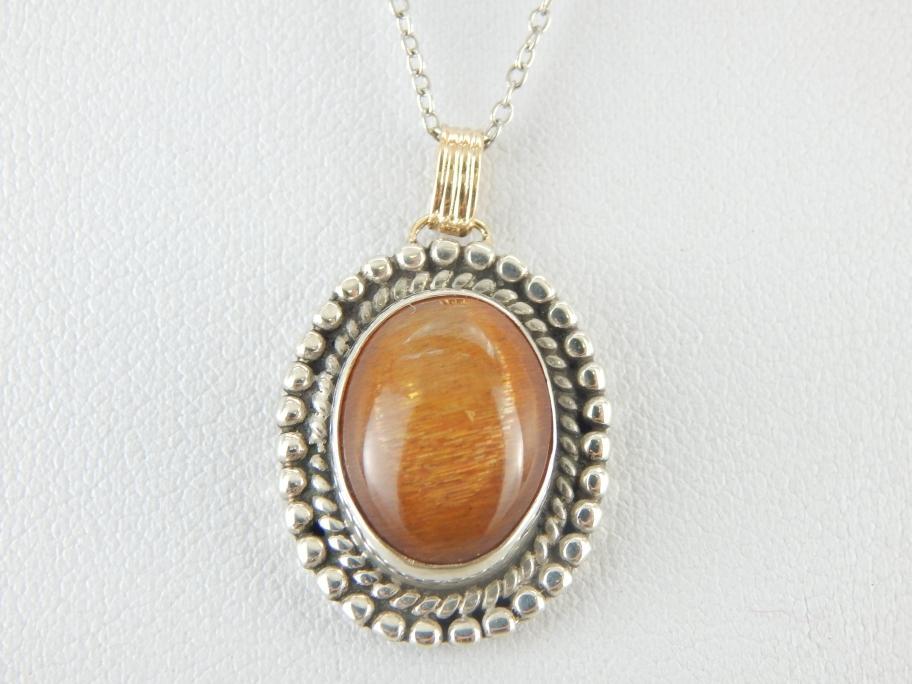 Glittering Orange Sunstone Pendant in Sterling and Gold Frame