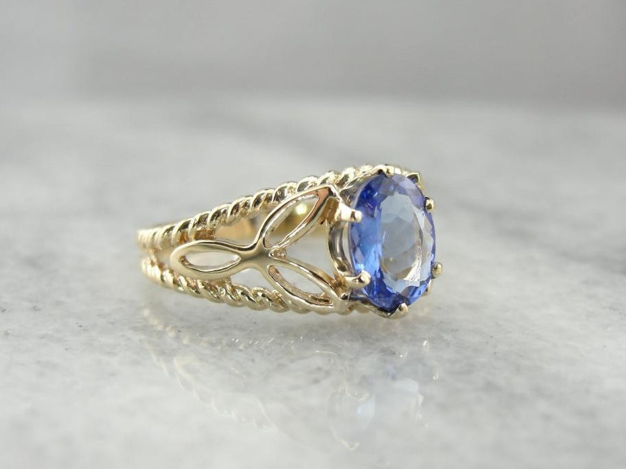 Tanzanite and Yellow Gold Ring with Filigree Trieskel Mounting