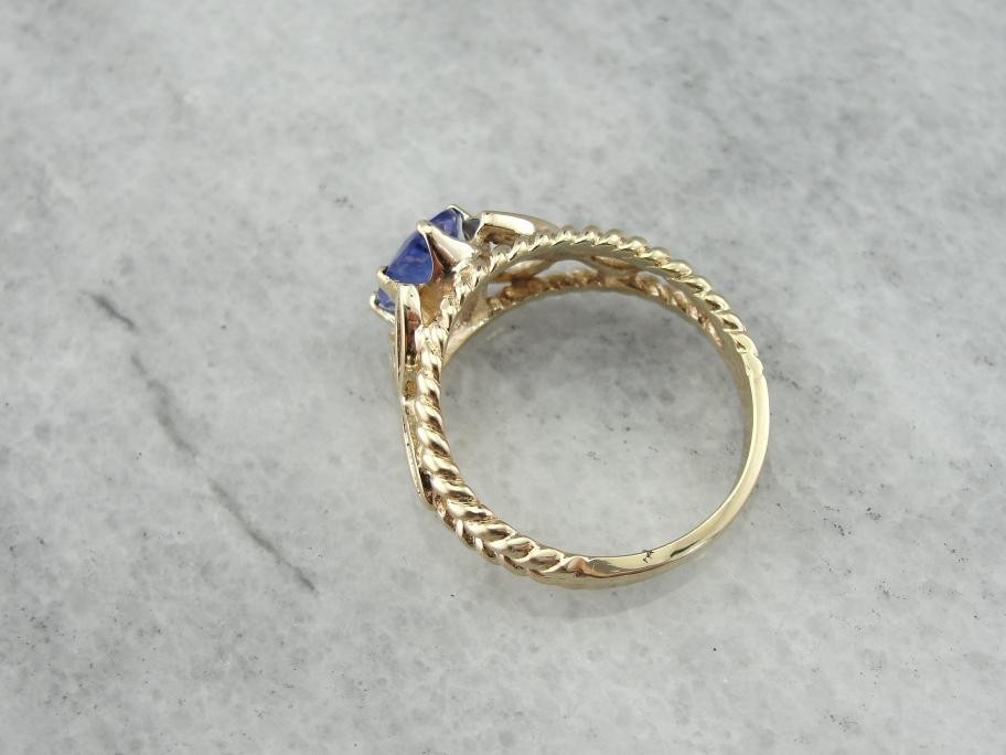 Tanzanite and Yellow Gold Ring with Filigree Trieskel Mounting