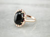 Black Onyx and Ruby Halo Ring
