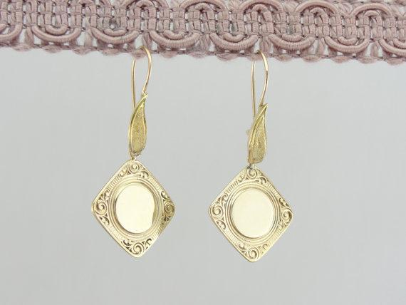 Impresionantes pendientes de gemelos art déco perseguidos