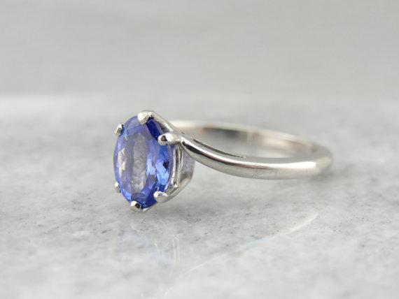 Twisting, Sleek Solitaire and Bright Tanzanite Ring