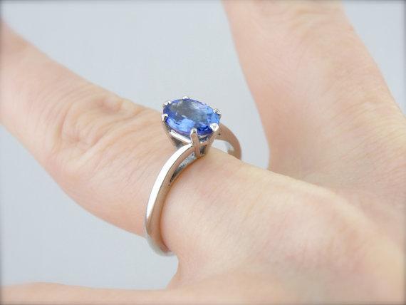 Twisting, Sleek Solitaire and Bright Tanzanite Ring