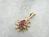Ruby and Diamond Halo Pendant in Yellow Gold