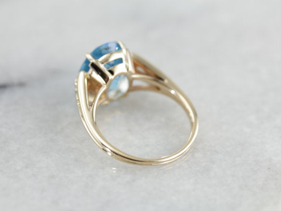 Brilliant Blue Topaz, Accented Split Shank Solitaire Ring in Yellow Gold