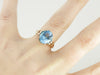 Brilliant Blue Topaz, Accented Split Shank Solitaire Ring in Yellow Gold