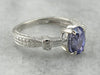 Contemporary Sapphire and Tapered Baguette Diamond Engagement Ring in Platinum