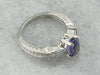 Contemporary Sapphire and Tapered Baguette Diamond Engagement Ring in Platinum