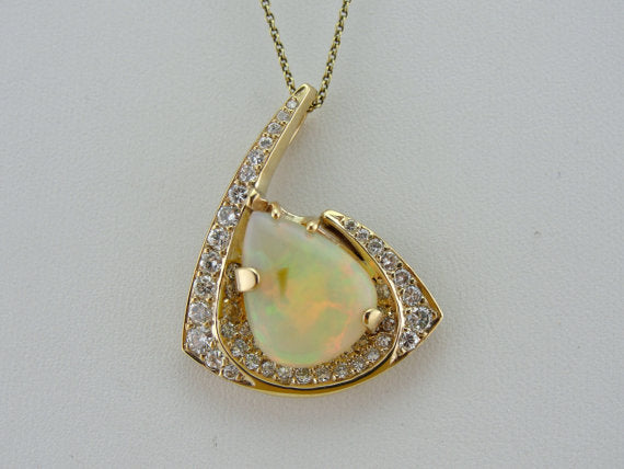 Ethiopian Opal Pendant in Modernist Gold and Diamond Frame