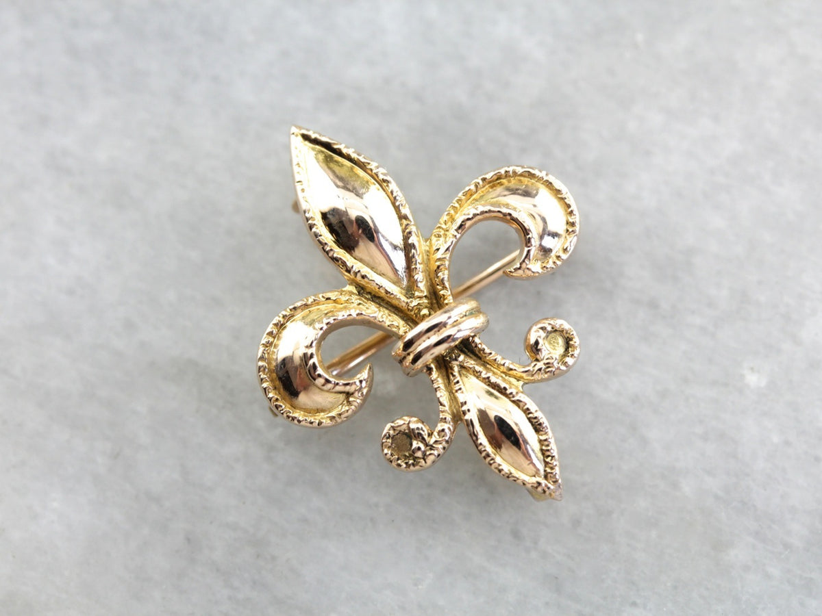 Broche de oro antiguo con flor de lis