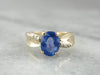 Twisting and Elegant Sapphire Ring with Diamond Accents